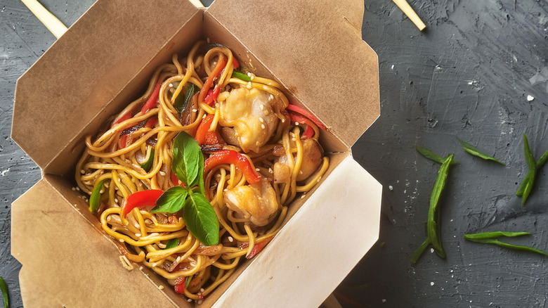 Chinese food in a cardboard takeout box