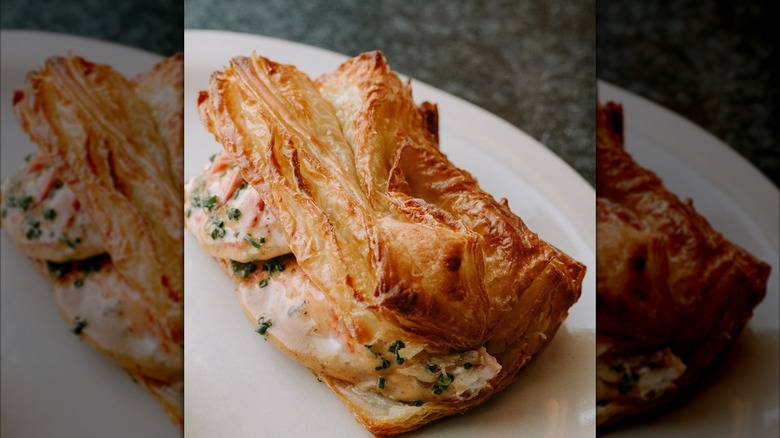 Twelve restaurant lobster roll on a white plate