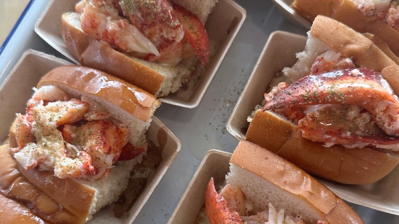 Luke's Lobster Portland Pier lobster rolls in to-go containers on a white tray