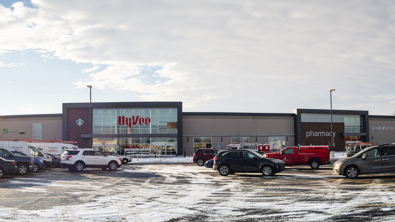 Hy-Vee store with snowy parking lot