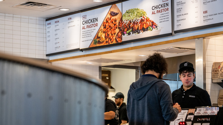 A customer ordering at Chipotle