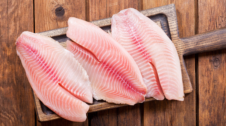 Fish filets on a wooden board