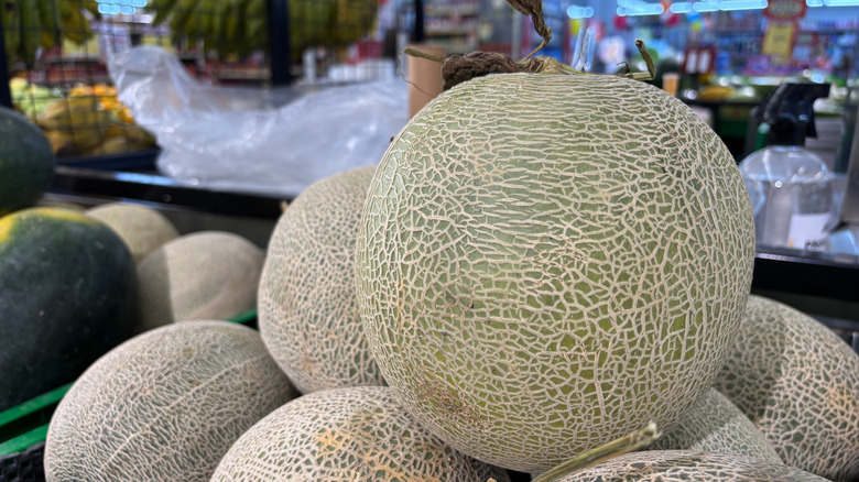 Cantaloupes stacked at supermarket