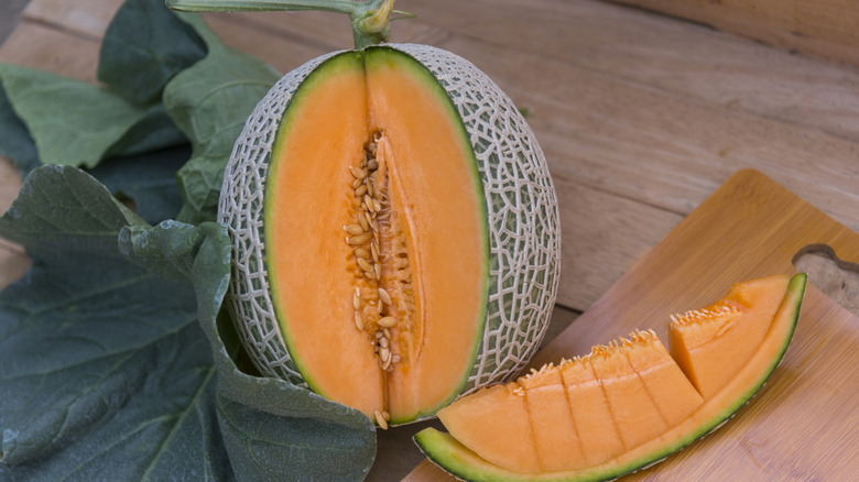 Bright orange cantaloupe with one portion removed
