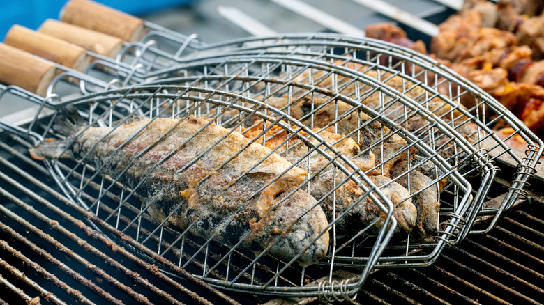 Fish cooking in grill baskets