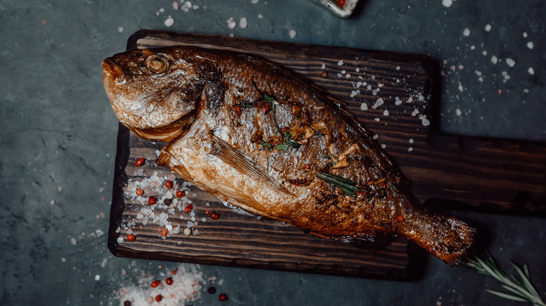 Grilled fish on a wooden board