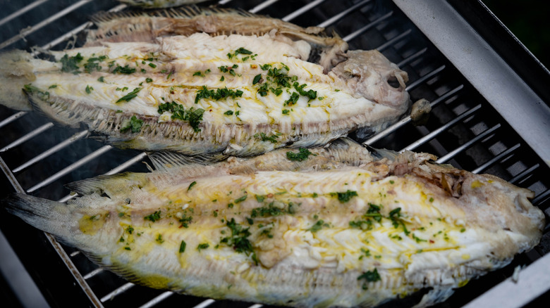 Sole fish cooking on the grill