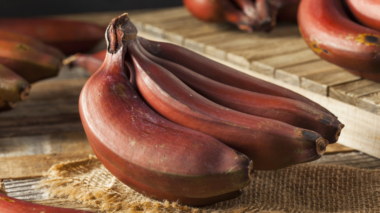 Red bananas on a wooden table