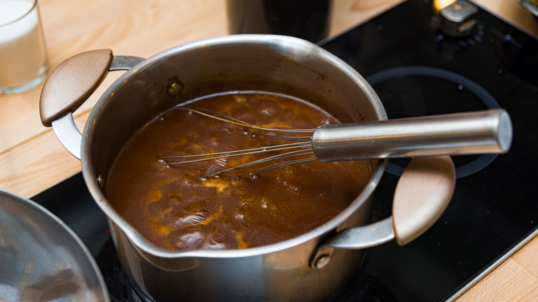 Simmering gravy with a whisk