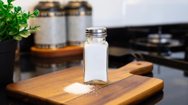 Salt shaker on a wooden board