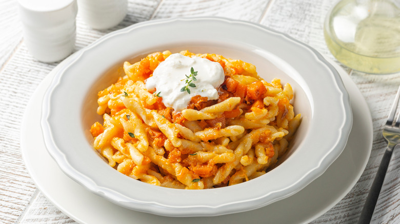 Pumpkin pasta with white cheese