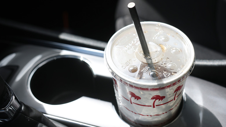 A drink in to go cup in cupholder in the car