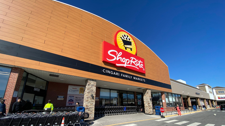 Low-angle exterior of a ShopRite supermarket, day