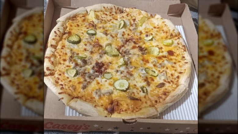 A Casey's bacon cheeseburger pizza in its box.