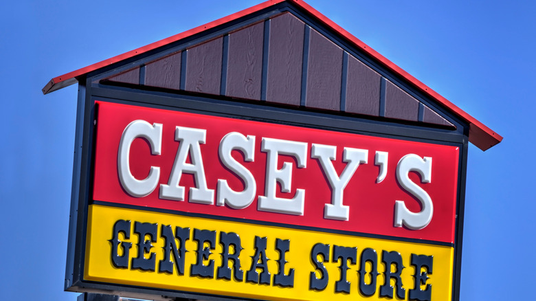 A Casey's General Store sign against a blue sky