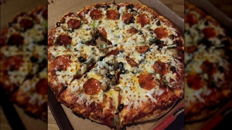 A Casey's supreme pizza in its box.