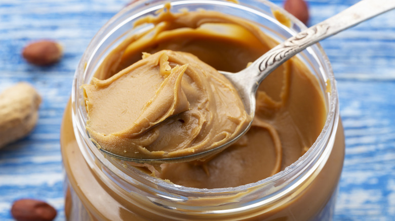 spoon in jar of peanut butter