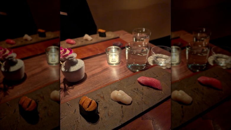 Sushi at Kosaka on table with glasses of water and candle