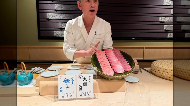 Chef at Yoshino showing off tuna trio slices