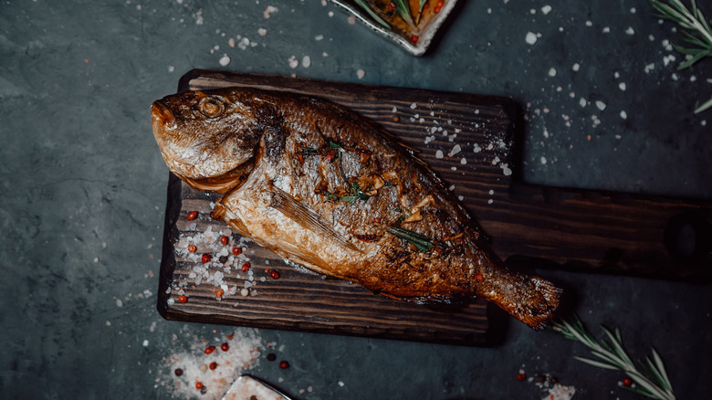 Cooked fish on a wooden board
