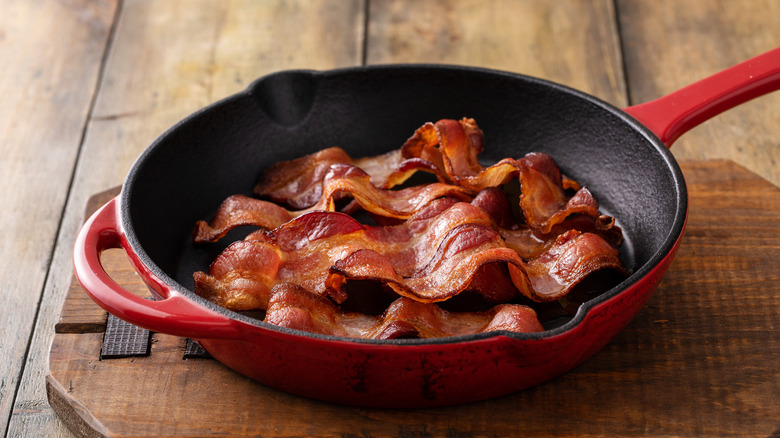 Cooked bacon strips in a pan