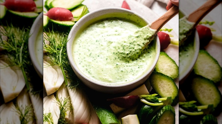 A bowl of Green Goddess dressing with crudites