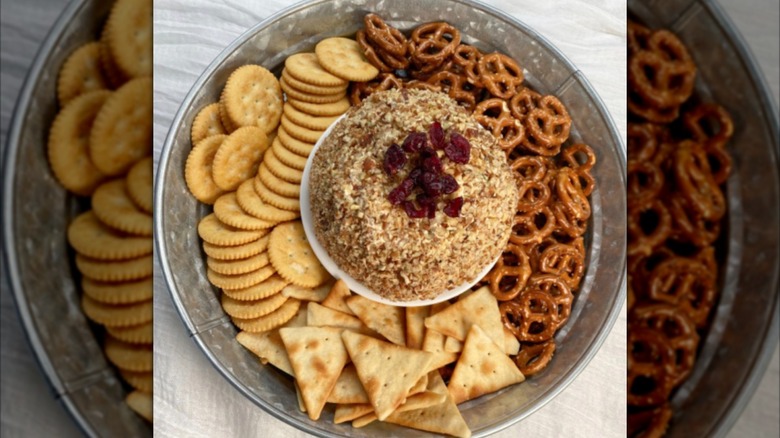 An Old English cheese ball topped with dried cranberries