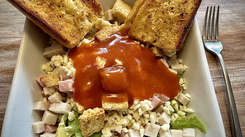 Salad with red dressing