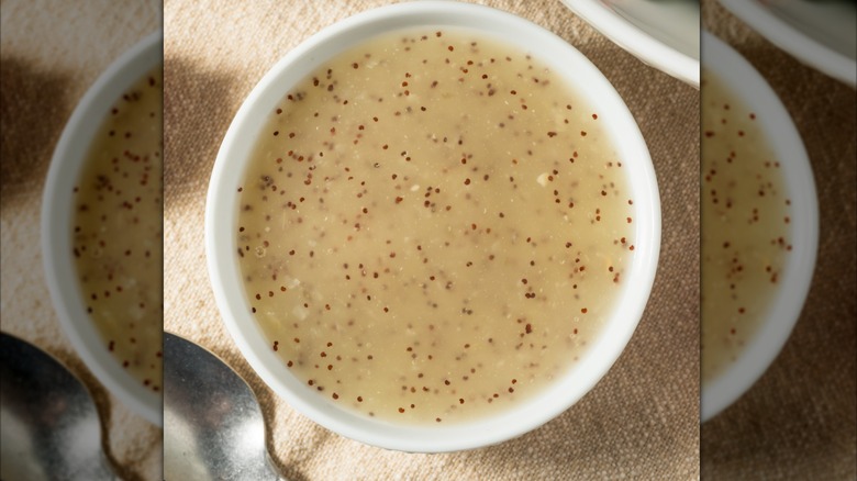 White bowl of poppy seed dressing