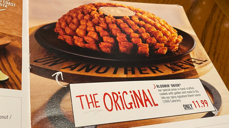 Photo of an outback steakhouse menu featuring the bloomin onion