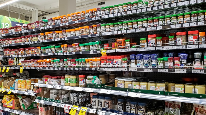 Bottled spices on the shelf at a grocery store