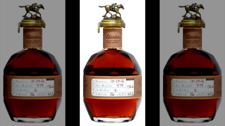 A bottle of Blanton's whiskey on a white background