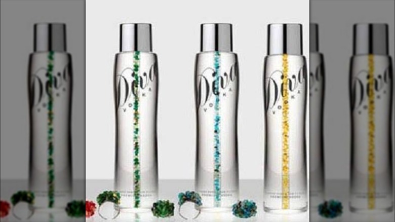 Three bottles of diva Vodka on a white background, mirrored
