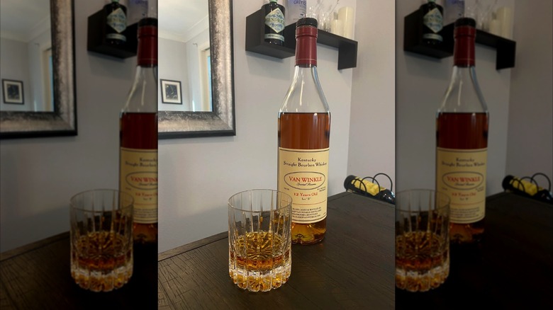 Van Winkle 12 Year Old Bourbon next to a glass on a table