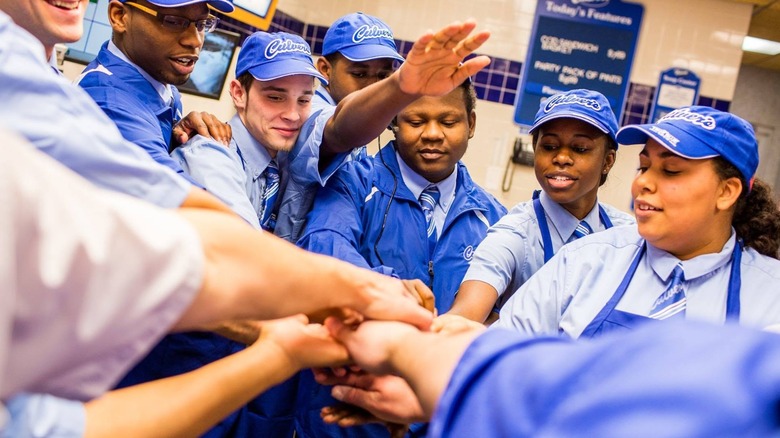 Culver's workers gathering around in a circle