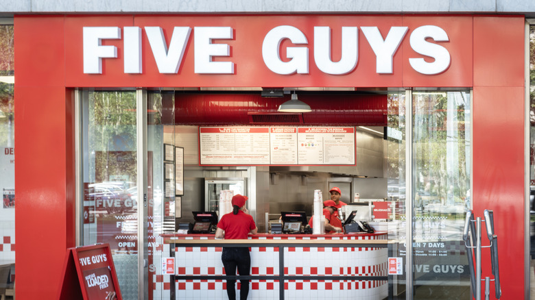 A Five Guys worker inside the restaurant