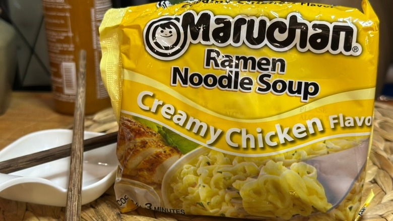 Maruchan Ramen Noodle Soup, Creamy Chicken Flavor on wicker mat with chopsticks