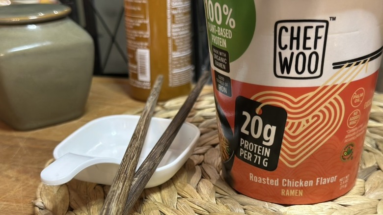 Chef Woo Roasted Chicken Ramen Cup with chopsticks