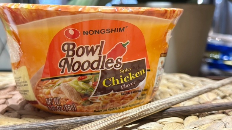 Nongshim Bowl Noodle Spicy Chicken Ramen Noodle Soup Bowl with chopsticks