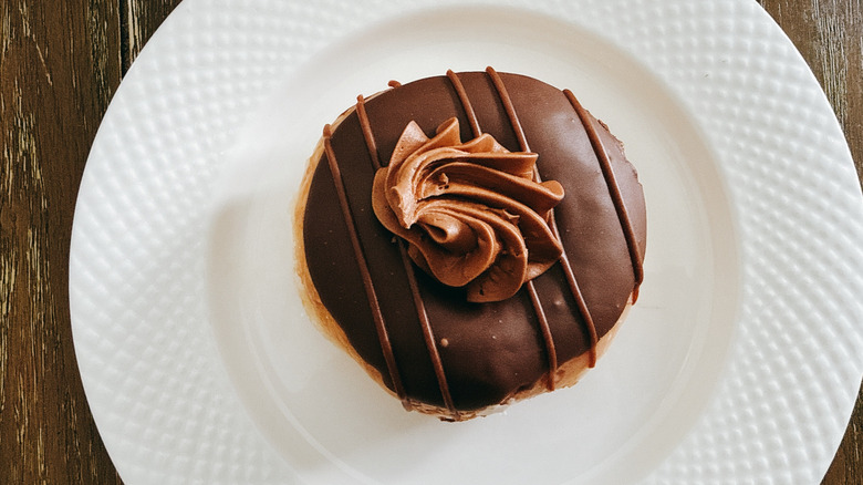 Krispy Kreme HERSHEY'S Double Chocolate Doughnut on white plate