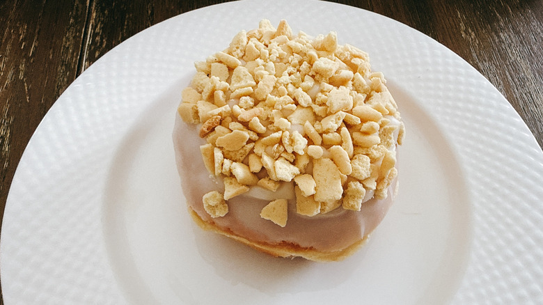 Krispy Kreme New York Cheesecake filled Doughnut on white plate