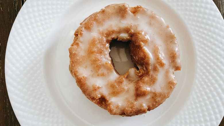 Krispy Kreme Original Glazed Cake Doughnut on white plate