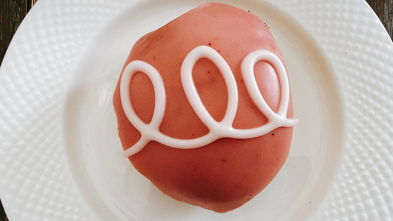 Krispy Kreme Strawberries and Kreme Doughnut on white plate