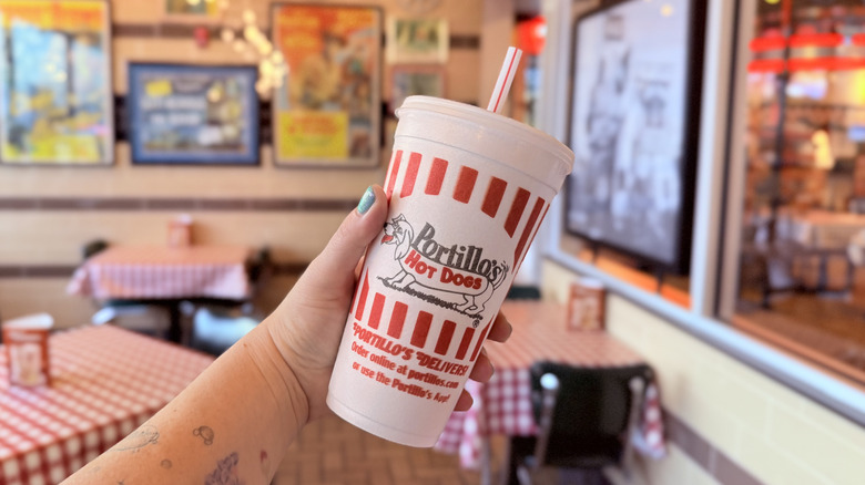 Hand holding a Chocolate Cake Shake at Portillo's