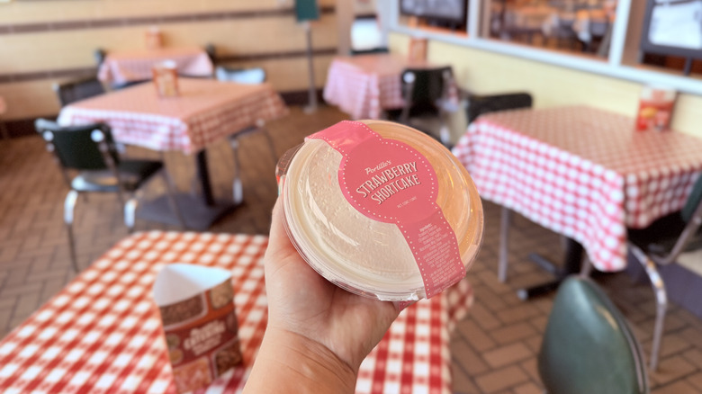 Hand holding a Strawberry Shortcake at Portillo's