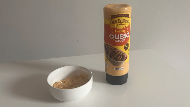 A tube of Old El Paso queso squeezed out into a little bowl