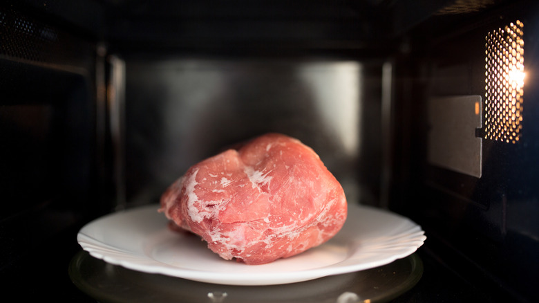 Raw meat in a microwave