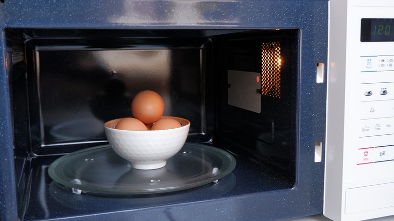 Eggs in shells in a microwave