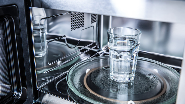 Glass of water in a microwave