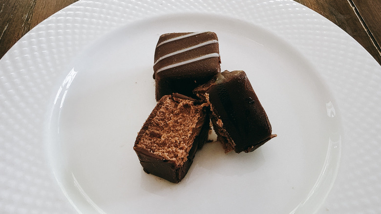 Publix cheesecake bites on white plate on wooden table